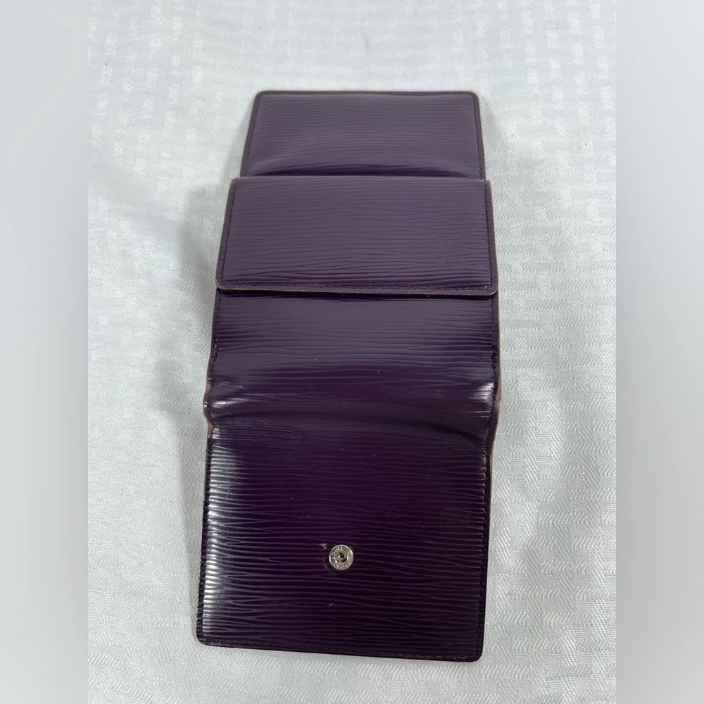 1136: Louis Vuitton Epi Leather Trifold Wallet Purple